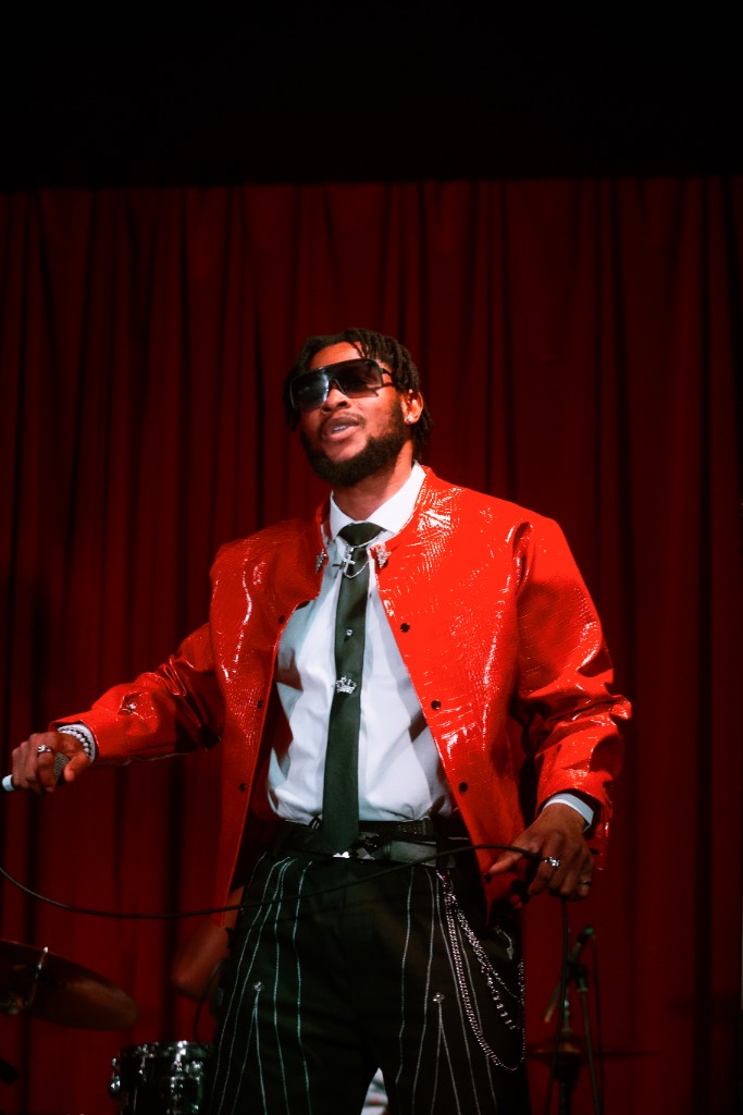 Ossy Brown singing live with microphone