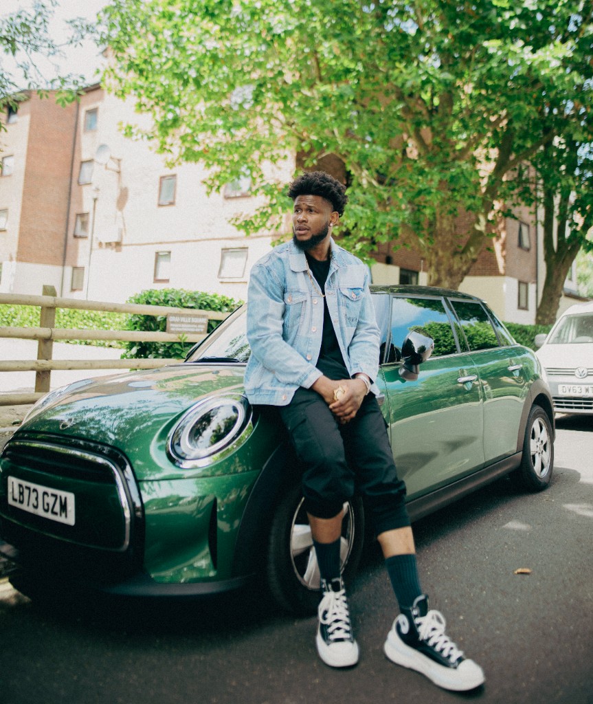 Ossy Brown with a green Mini Cooper