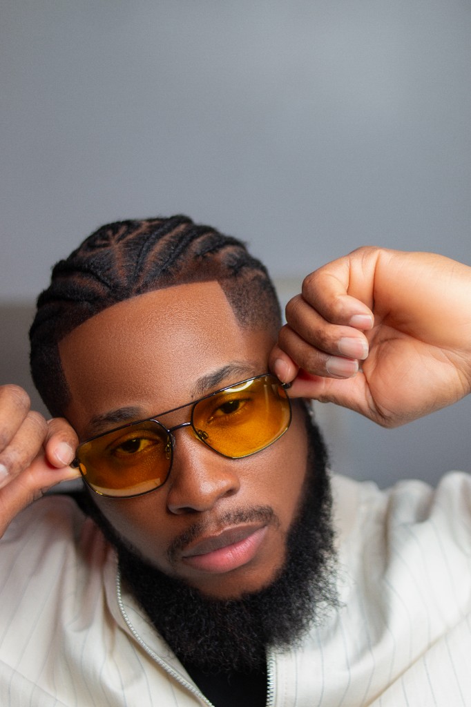 Ossy Brown holding his glasses
